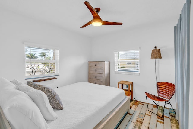 bedroom featuring hardwood / wood-style floors and ceiling fan