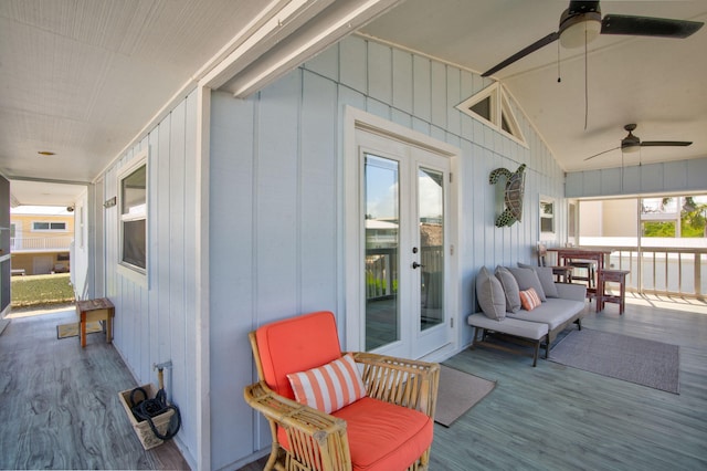 deck with french doors and ceiling fan