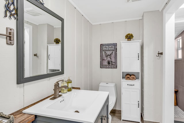 bathroom featuring vanity and toilet