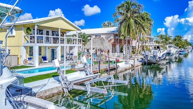 exterior space with a balcony and a water view