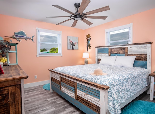 bedroom featuring light hardwood / wood-style flooring and ceiling fan