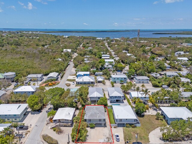 973 Gibraltar Rd, Key Largo, FL 33037 - aerial perspective of suburban area featuring a large body of water and property parcel outlined