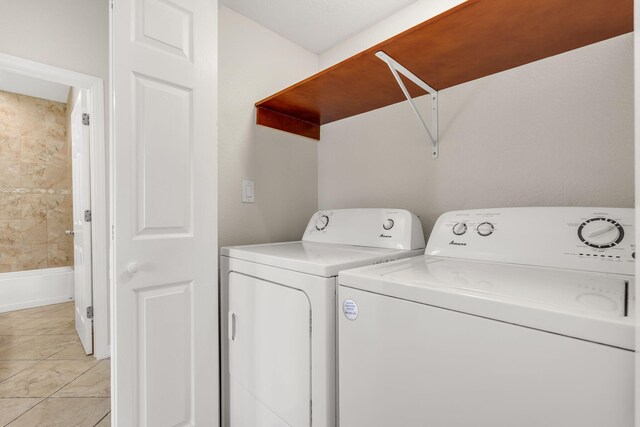 973 Gibraltar Rd, Key Largo, FL 33037 - laundry area with washer and dryer and light tile patterned flooring
