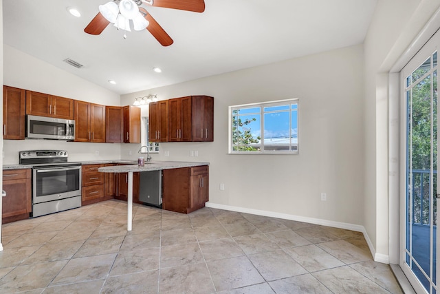 973 Gibraltar Rd, Key Largo, FL 33037 - kitchen with appliances with stainless steel finishes, vaulted ceiling, ceiling fan, recessed lighting, and baseboards