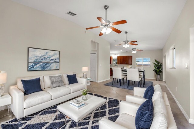 973 Gibraltar Rd, Key Largo, FL 33037 - living room featuring lofted ceiling, a ceiling fan, and baseboards