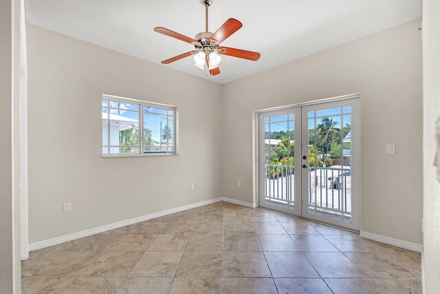 973 Gibraltar Rd, Key Largo, FL 33037 - unfurnished room with french doors, ceiling fan, and baseboards