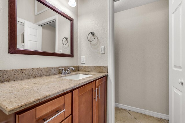 973 Gibraltar Rd, Key Largo, FL 33037 - bathroom with tile patterned floors, vanity, and baseboards