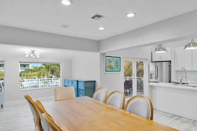 853 Ellen Dr, Key Largo, FL 33037 - dining space featuring light wood-style flooring, french doors, recessed lighting, and baseboards