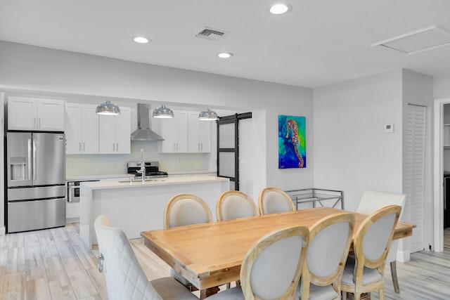 853 Ellen Dr, Key Largo, FL 33037 - dining room with light wood finished floors and recessed lighting