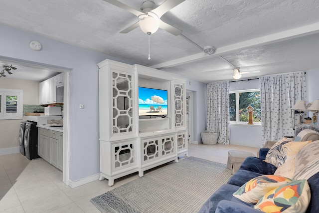 853 Ellen Dr, Key Largo, FL 33037 - living room with ceiling fan, light tile patterned floors, a textured ceiling, baseboards, and beamed ceiling