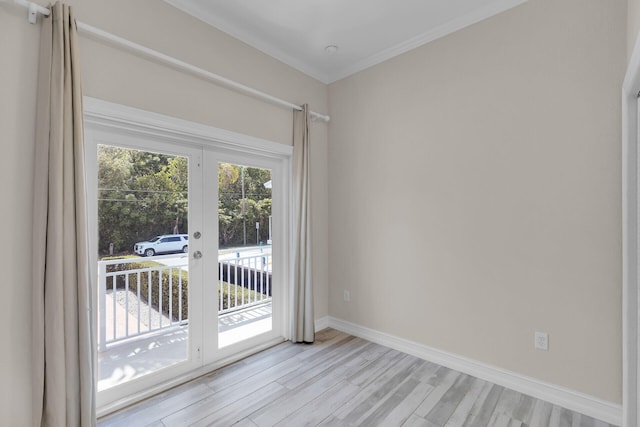 853 Ellen Dr, Key Largo, FL 33037 - empty room featuring light wood-style floors, baseboards, french doors, and ornamental molding