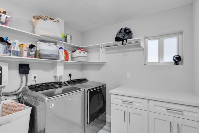 853 Ellen Dr, Key Largo, FL 33037 - laundry area with cabinet space and washer and dryer