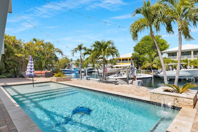 853 Ellen Dr, Key Largo, FL 33037 - outdoor pool featuring a dock, a water view, and boat lift