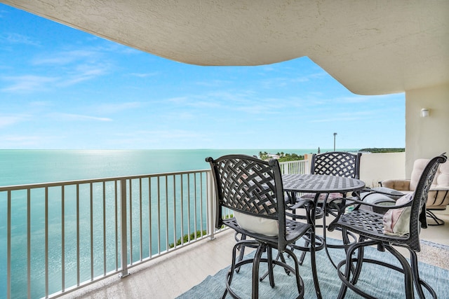 balcony featuring a water view