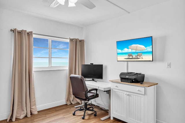 home office with ceiling fan and light wood-type flooring