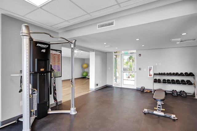 workout area with a drop ceiling