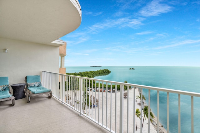 balcony featuring a water view