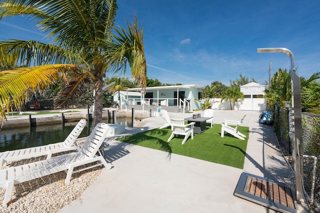 view of patio featuring a water view