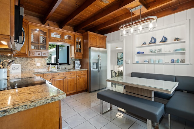 kitchen with pendant lighting, sink, breakfast area, stainless steel appliances, and wooden ceiling