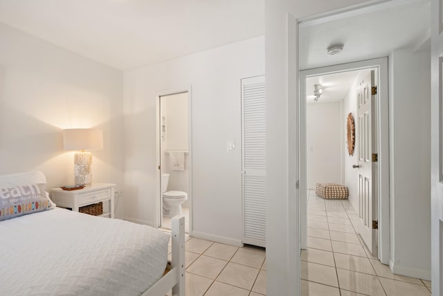 tiled bedroom with connected bathroom