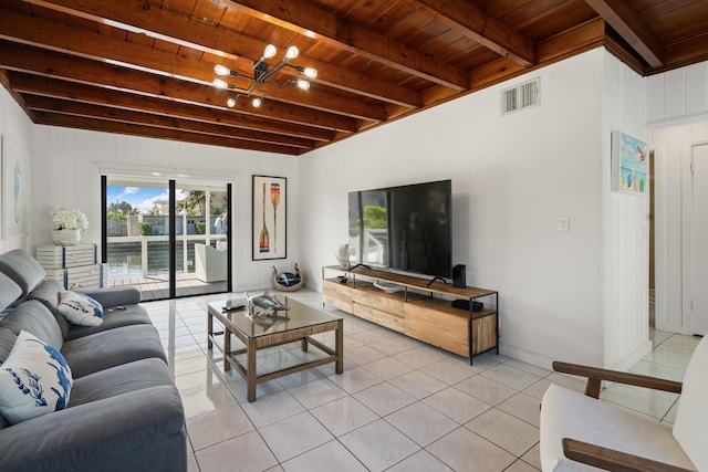 living room featuring wood ceiling, beamed ceiling, a notable chandelier, and light tile patterned floors