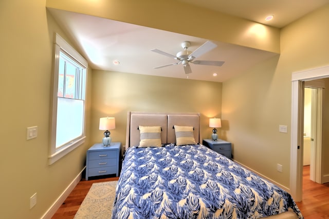 bedroom featuring hardwood / wood-style flooring and ceiling fan