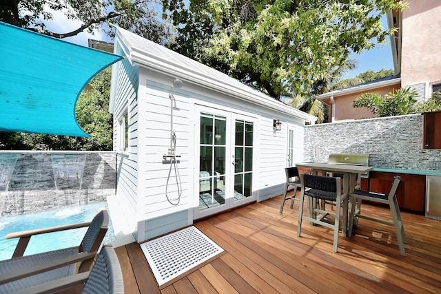 wooden deck with french doors