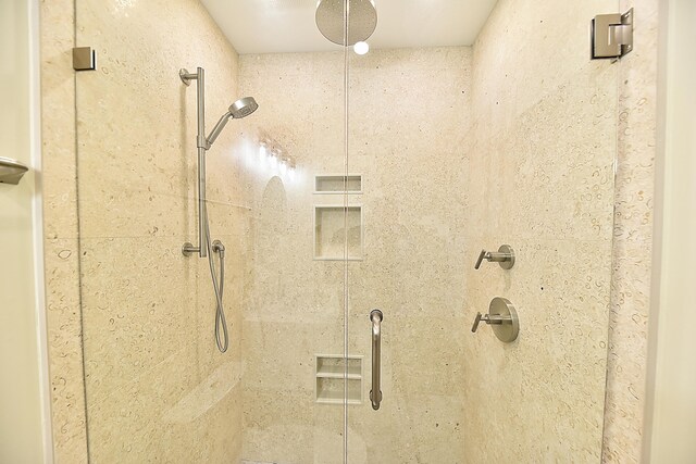 bathroom with tiled shower