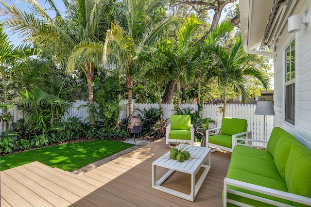 wooden deck with fence and an outdoor living space