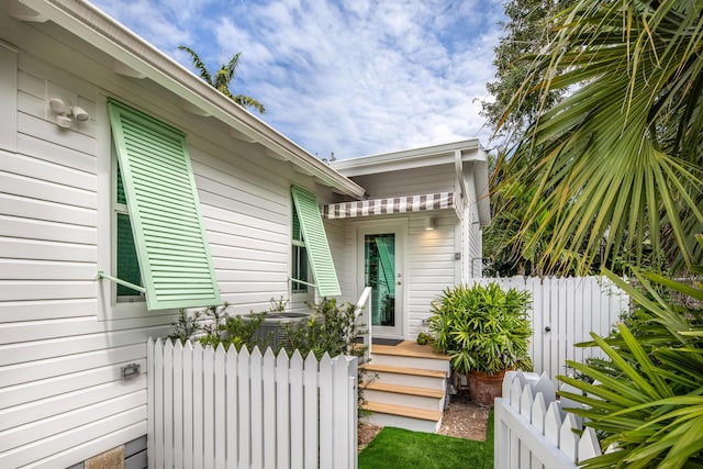 view of home's exterior with fence and central air condition unit