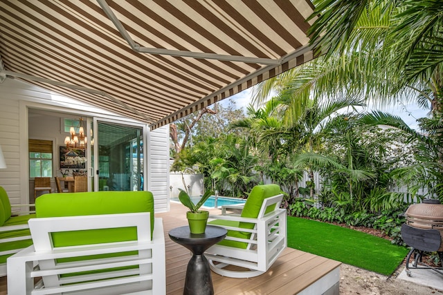 deck featuring a fenced in pool and fence