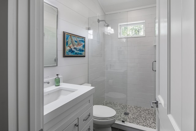 full bath with toilet, a shower stall, and vanity