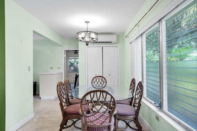 dining space with an inviting chandelier and an AC wall unit