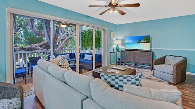 living room with ceiling fan and wood-type flooring