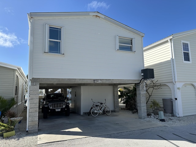 rear view of house with central air condition unit