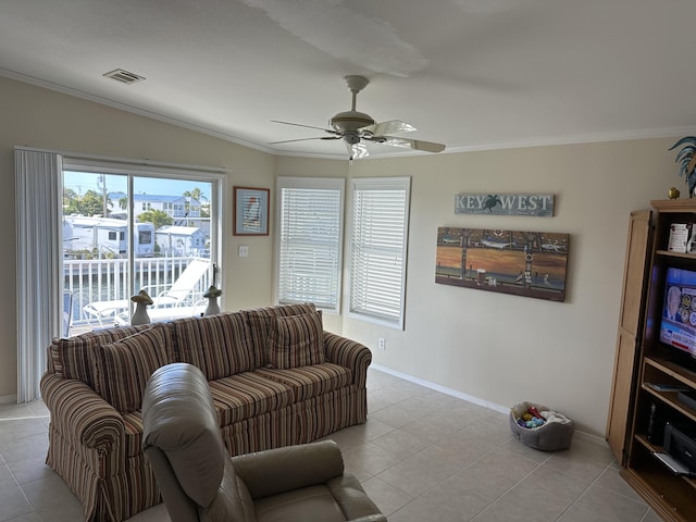 living room featuring light tile patterned floors, crown molding, and ceiling fan