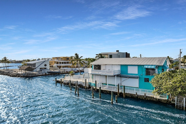 view of dock featuring a balcony and a water view