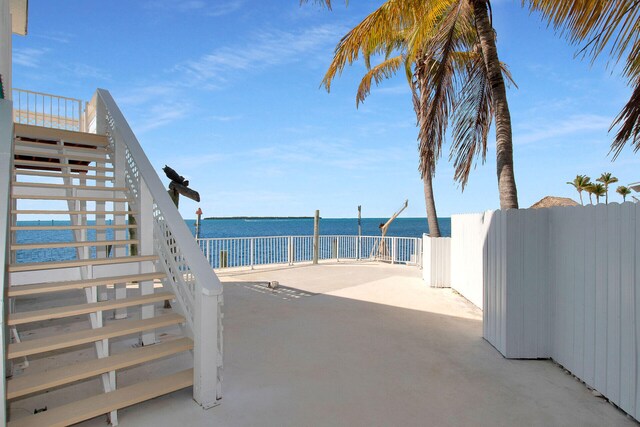 view of patio with a water view