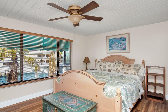 bedroom featuring dark hardwood / wood-style floors and ceiling fan