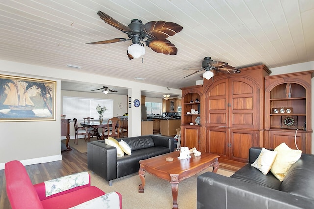 living room featuring ceiling fan, wood ceiling, and light wood-type flooring