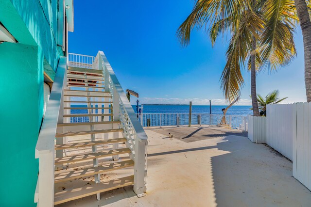 view of patio featuring a water view