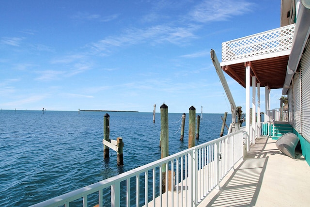 exterior space featuring a water view and a dock