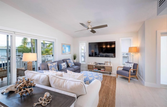 121 Lisbon Ct, Islamorada, FL 33036 - living room featuring visible vents, baseboards, vaulted ceiling, light wood-style floors, and a ceiling fan