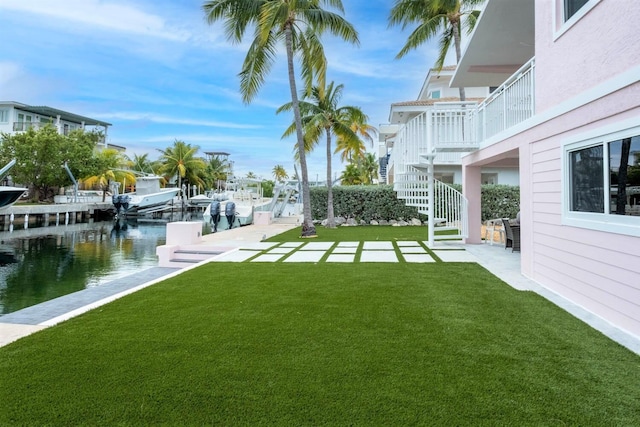 121 Lisbon Ct, Islamorada, FL 33036 - view of yard featuring stairway, a boat dock, and a water view
