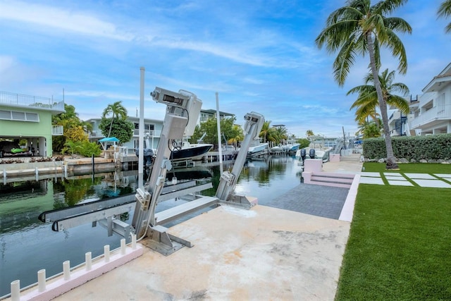 121 Lisbon Ct, Islamorada, FL 33036 - dock area with a lawn, a water view, and boat lift