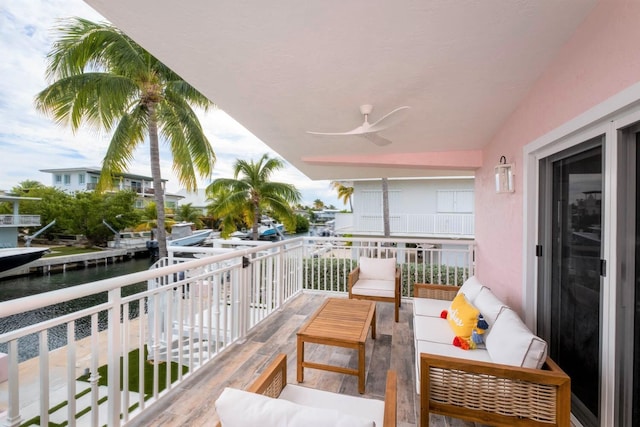 121 Lisbon Ct, Islamorada, FL 33036 - balcony featuring an outdoor living space, ceiling fan, and a water view