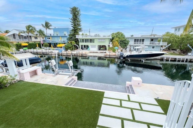 121 Lisbon Ct, Islamorada, FL 33036 - dock area featuring a lawn and a water view
