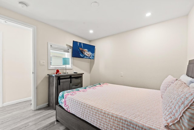 bedroom with light hardwood / wood-style flooring