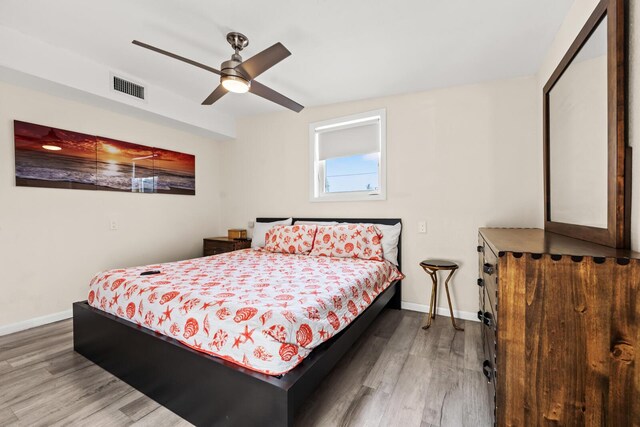 bedroom featuring hardwood / wood-style floors and ceiling fan