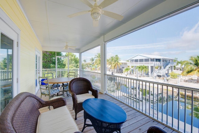 wooden terrace with a ceiling fan